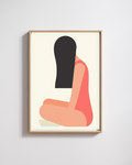 Framed abstract art print of a stylized figure on a white wall