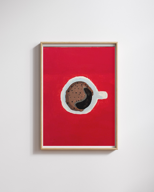 Framed artwork of a coffee cup on a red background