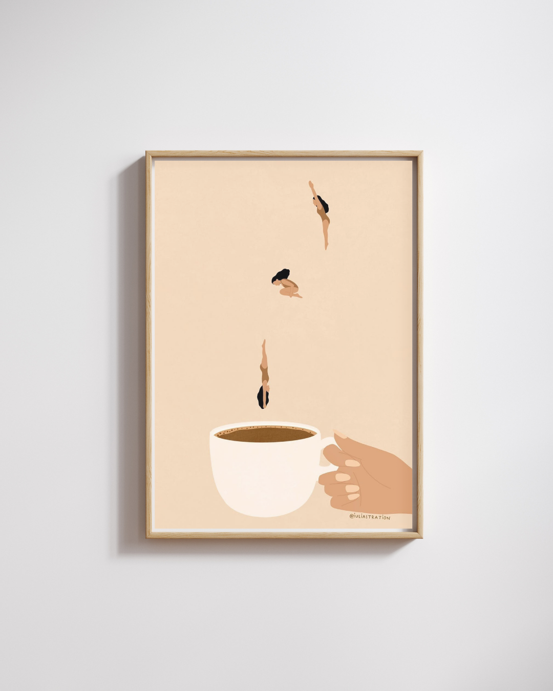 Framed artwork of a coffee cup with hands and droplets on a beige background