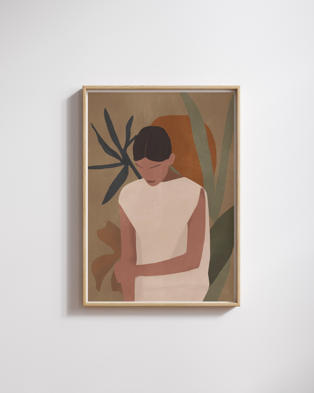 Framed artwork of a person with plants on a light gray wall