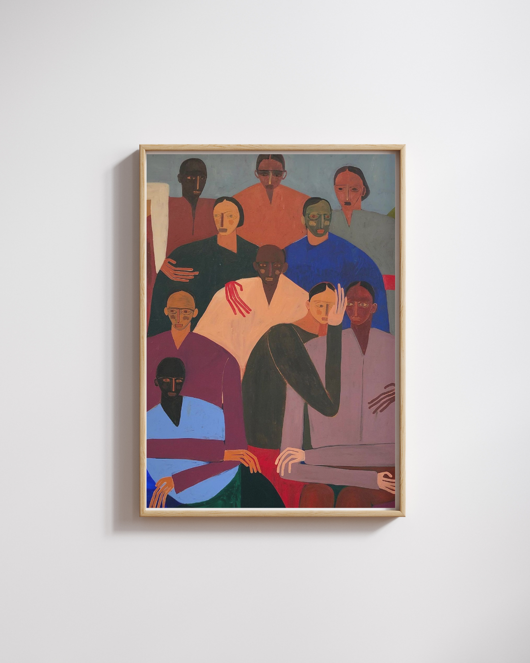 Framed artwork of a group of people on a white wall